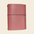 Pink journal on a beige background