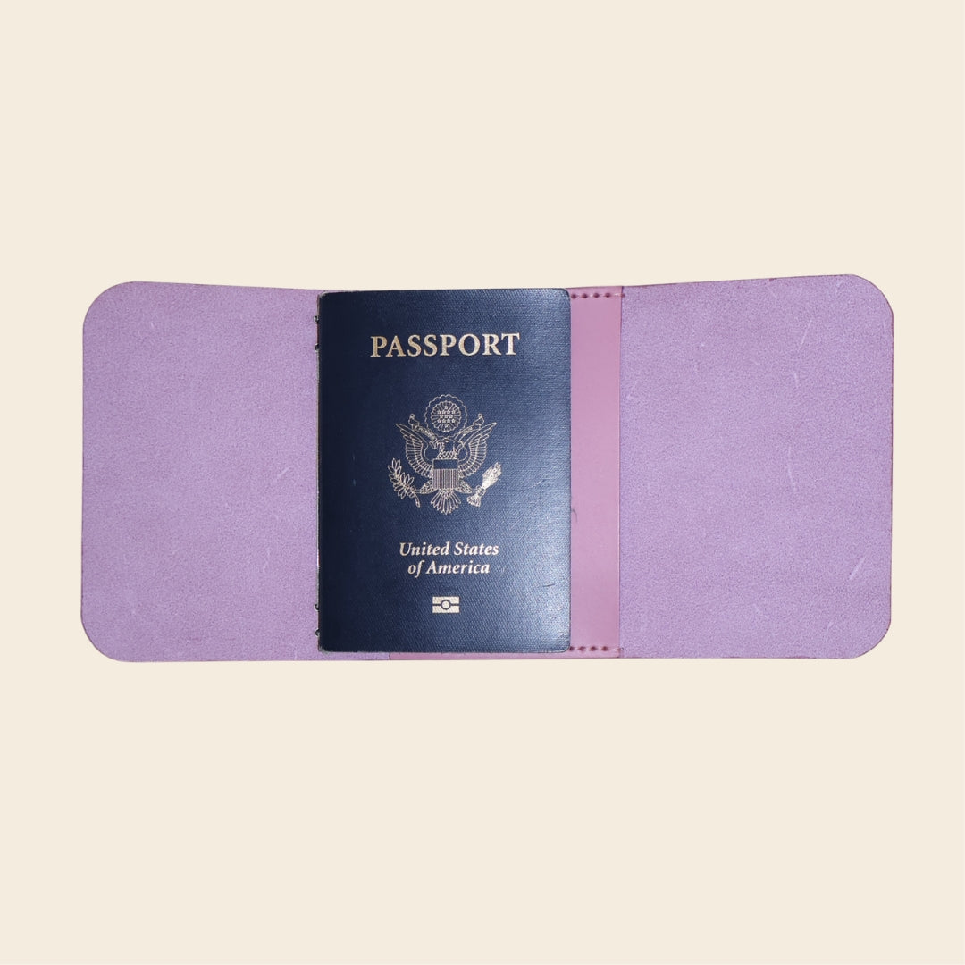 Passport with a purple cover on a beige background