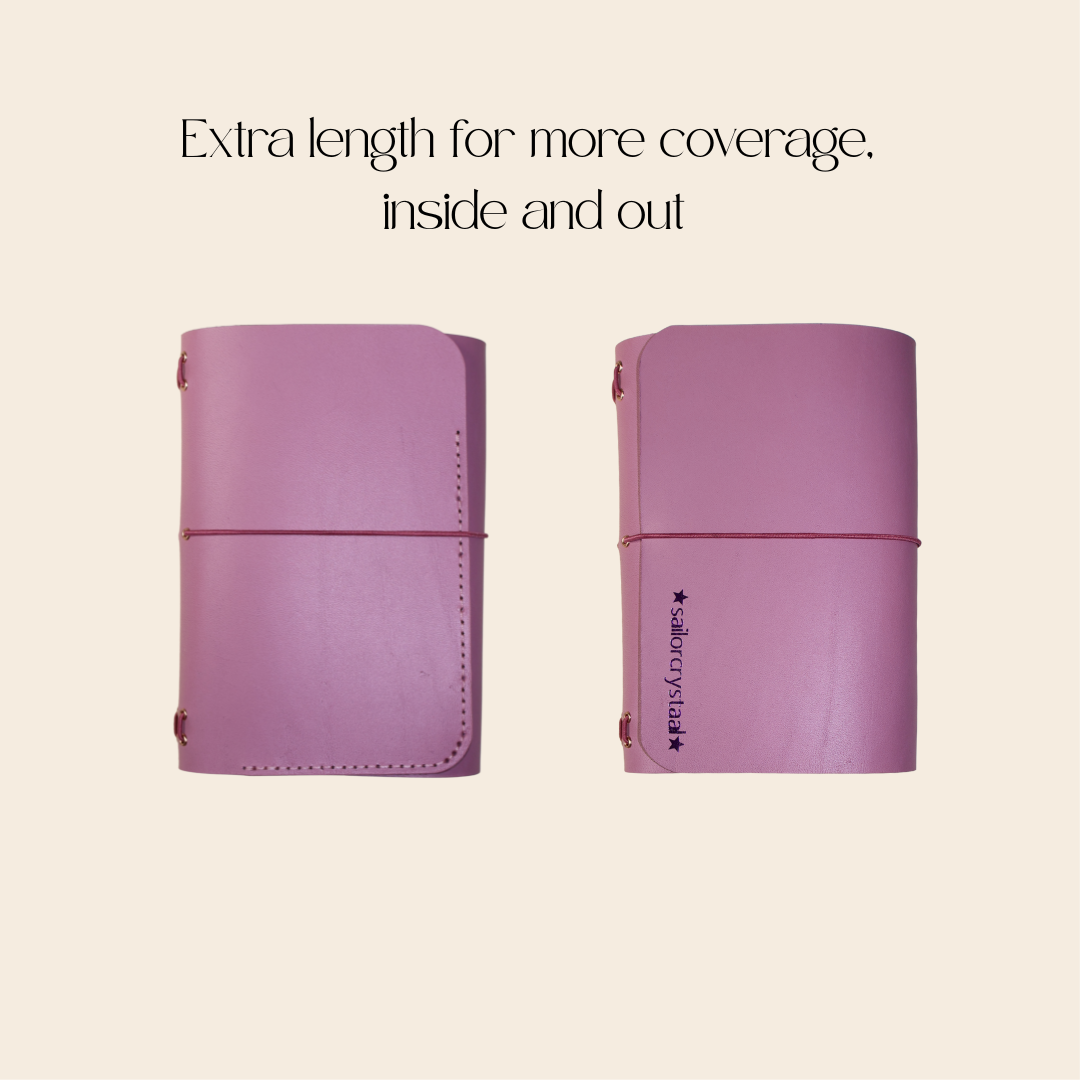 Two mauve leather journals with text on a beige background