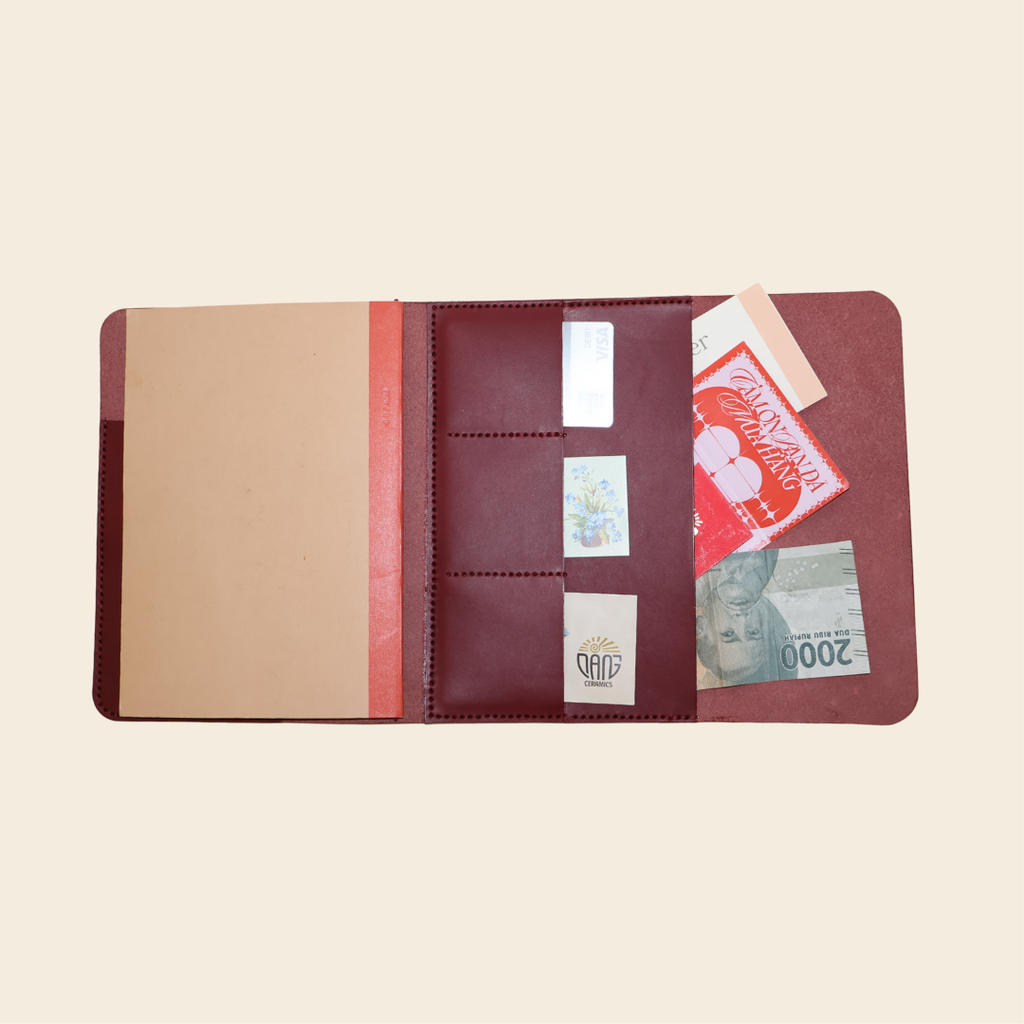 Multifunctional leather wallet with card slots and back pocket on a beige background